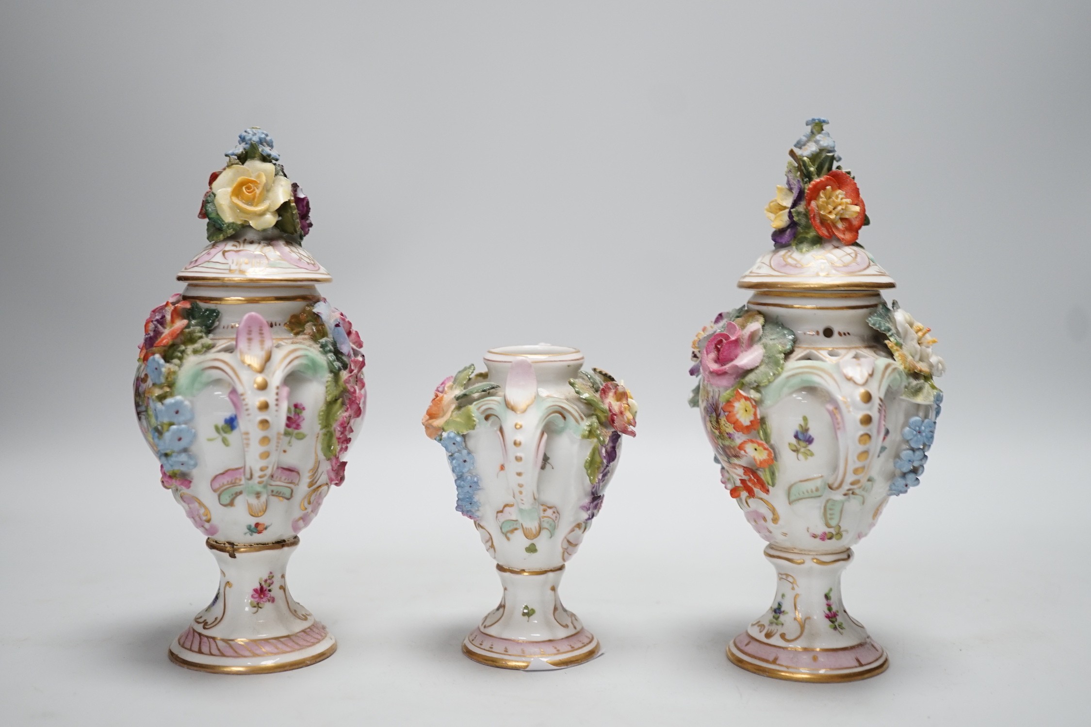 Three 19th century Dresden floral encrusted vases, two with covers, 16cm